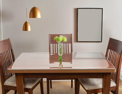clear PVC table protector on wooden dining table